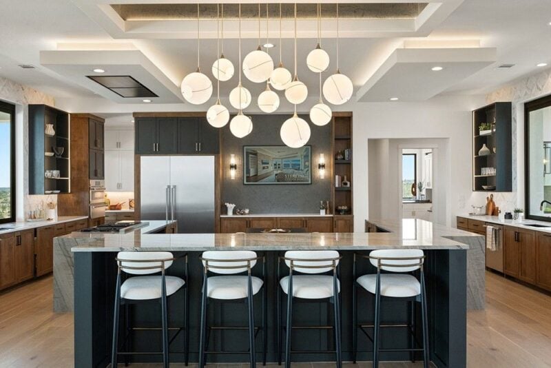 Kitchen view of Hilltop Haven by Sterling Custom Homes. View at the 2026 Austin Parade of Homes.